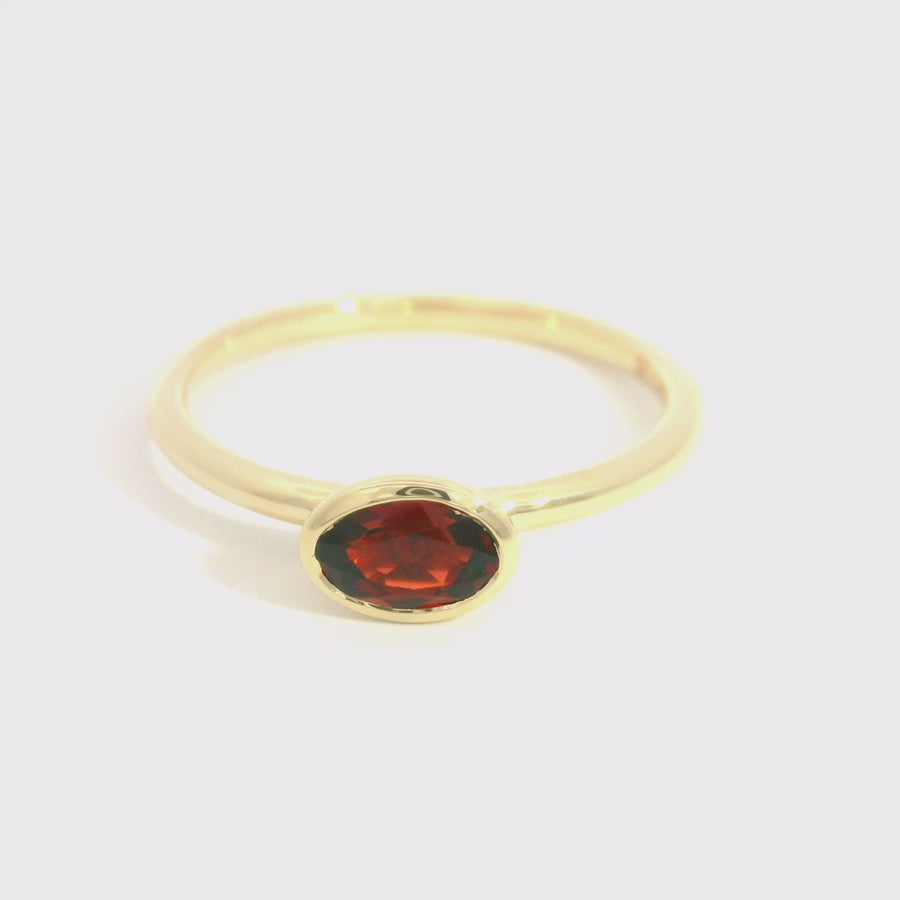 Oval Cut Garnet & Yellow Gold Dress Ring